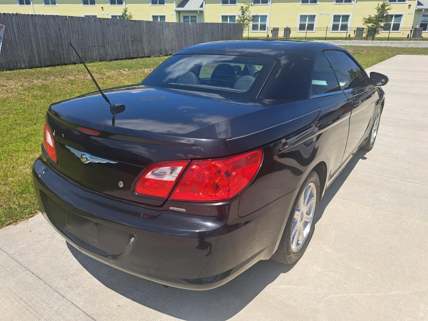 2009 Black Chrysler Sebring (1C3LC55D39N) , located at 1181 Aurora Rd, Melbourne, FL, 32935, (321) 241-1100, 28.132914, -80.639175 - Photo#2